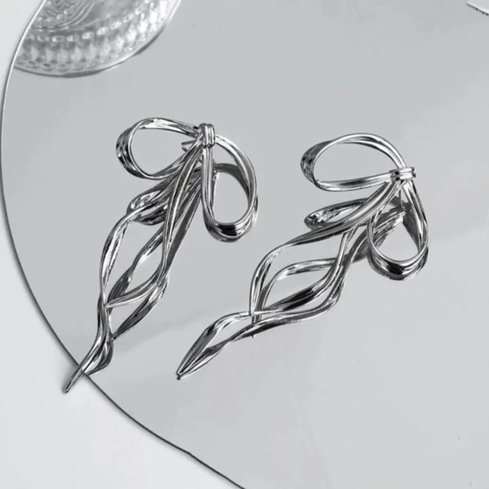 Anthro Silver Bow Earring